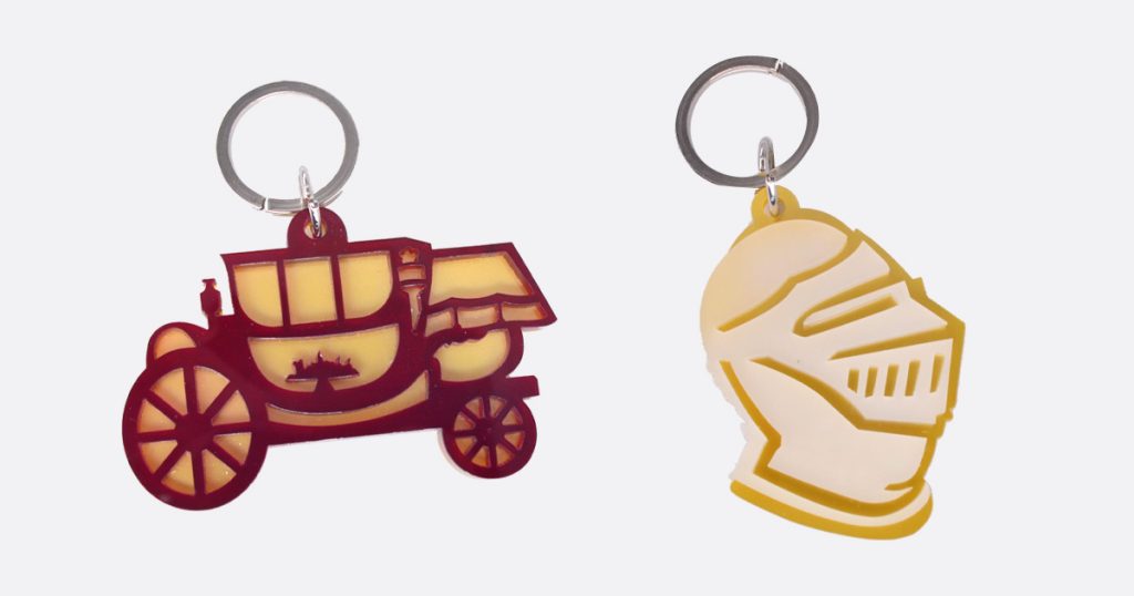 Llaveros doble capa. Carruaje y yelmo.